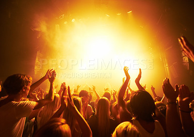 Buy stock photo Rear-view of a crowd cheering at a concert- This concept was created for the sole purpose of this photo shoot, featuring 300 models and 3 live bands. All people in this shoot are model released