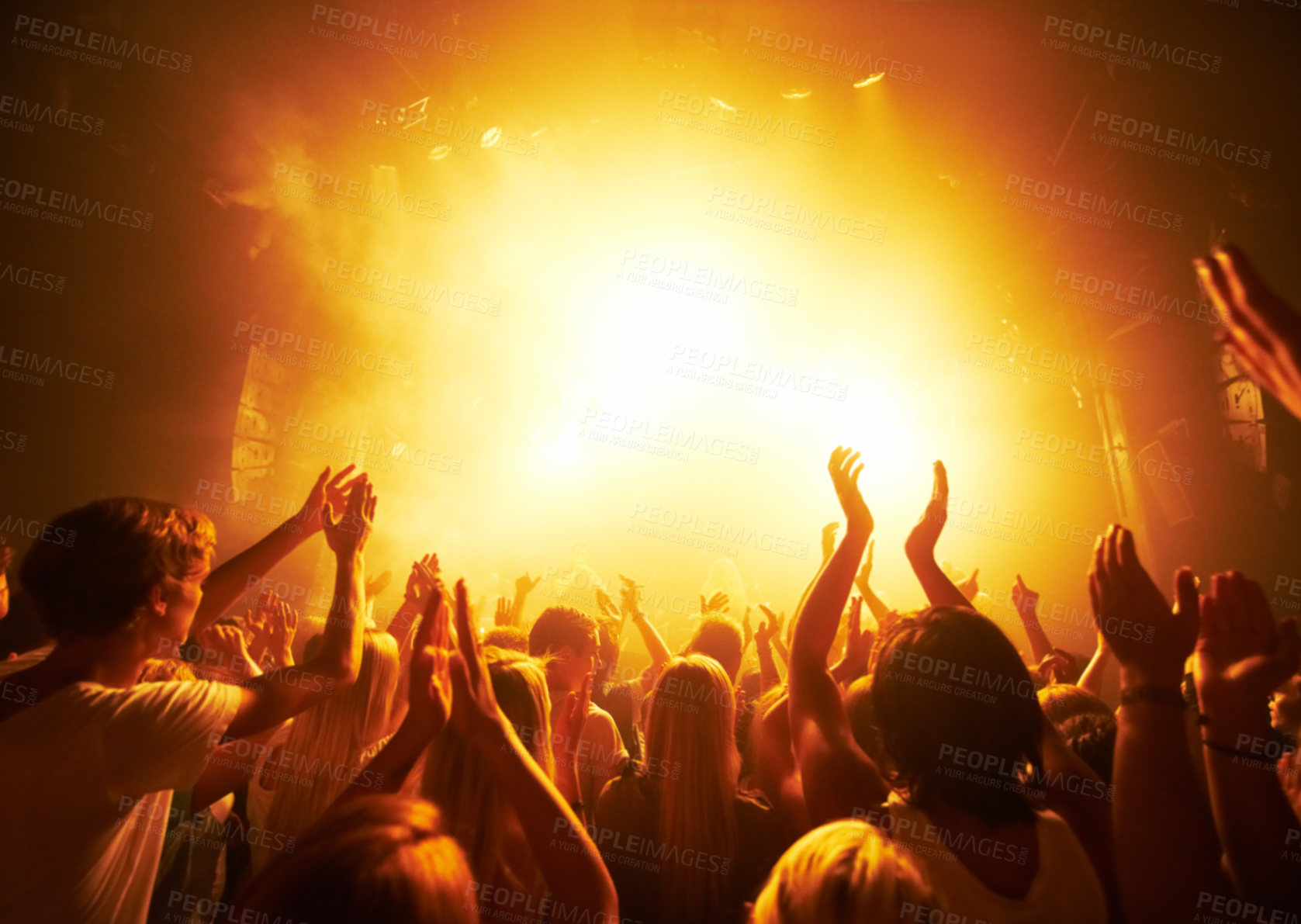 Buy stock photo Rear-view of a crowd cheering at a concert- This concept was created for the sole purpose of this photo shoot, featuring 300 models and 3 live bands. All people in this shoot are model released