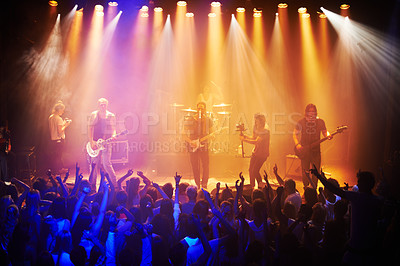 Buy stock photo Shot of a large crowd at a music concert-This concert was created for the sole purpose of this photo shoot, featuring 300 models and 3 live bands. All people in this shoot are model released