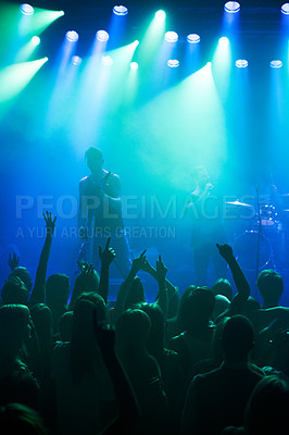 Buy stock photo Shot of a large crowd at a music concert- This concert was created for the sole purpose of this photo shoot, featuring 300 models and 3 live bands. All people in this shoot are model released
