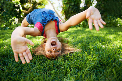 Buy stock photo Child, back and bend or bridge for play in summer or flexibility game or practice, fun or backyard. Kid, face and hands or gymnastics stretching with head balance on grass in London, happy or garden