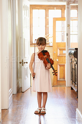 Buy stock photo Violin, girl and portrait of child in home for learning, practice or music education. Art, fiddle and student with bow for talent, creative or hobby in house with acoustic string instrument in Canada