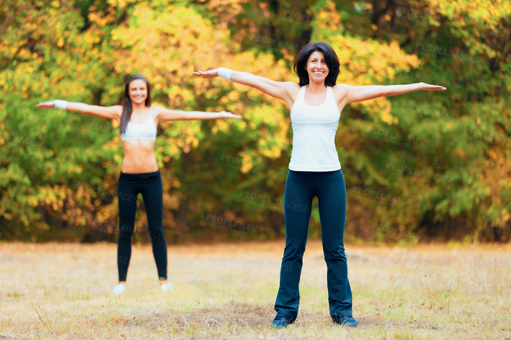 Buy stock photo Women, arm stretching and portrait in a outdoor park for yoga and fitness. Health, wellness and arms exercise of female friends in nature on grass feeling happy with smile from body and sport