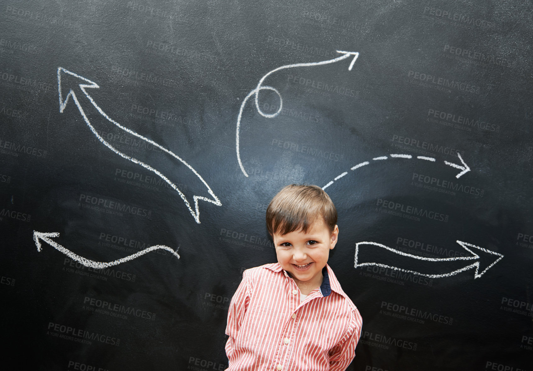 Buy stock photo Studio shot of an adorable little boy with chalk drawings behind him