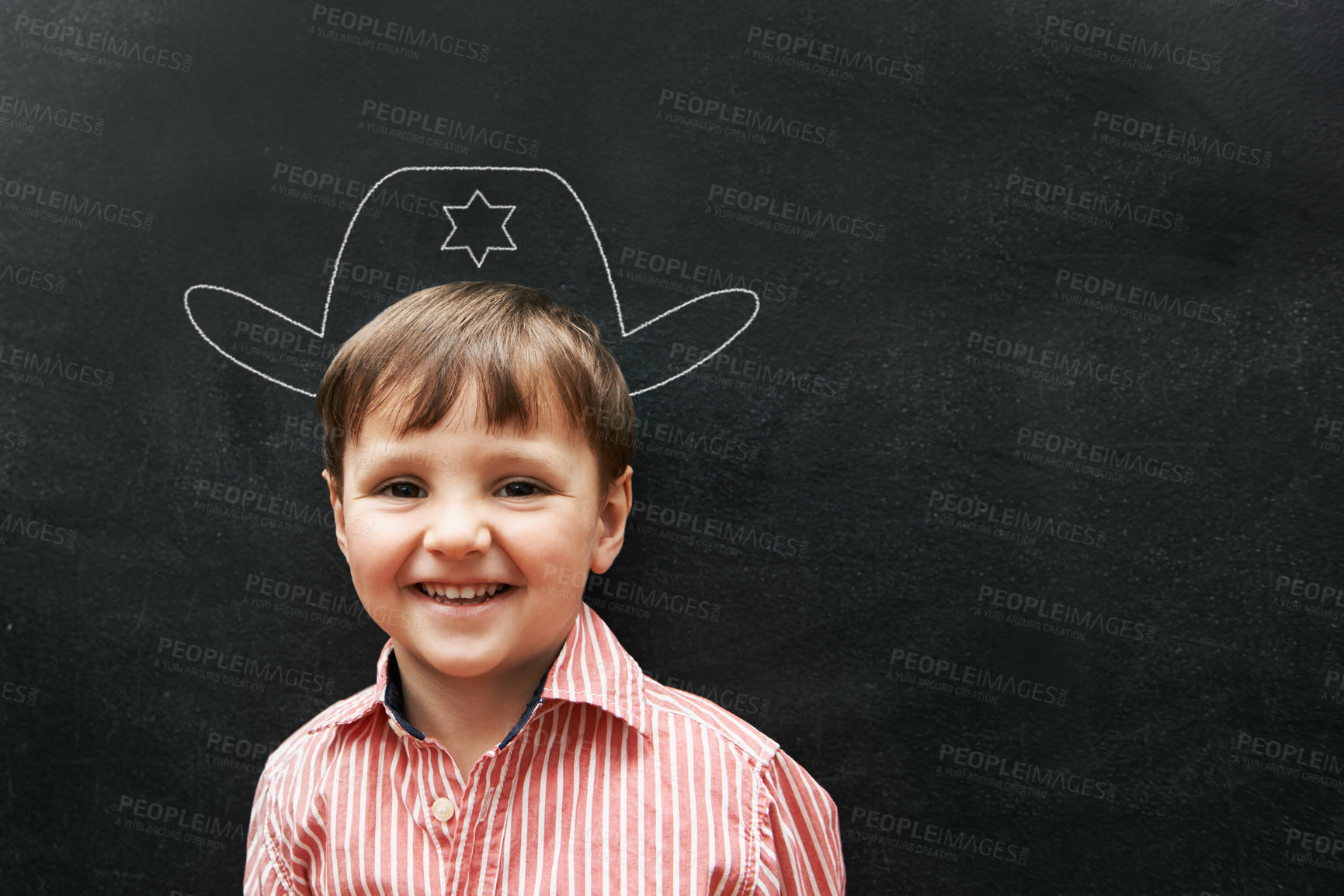Buy stock photo Boy, portrait and chalk with cowboy hat on board with smile in class, school and drawing for young skill development. Kid, blackboard and creativity for learning, education and growth with happiness