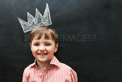 Buy stock photo Boy, portrait and crown on chalkboard with smile from cute learner in preschool. Young student, happy and learning in classroom for education in art for development of creativity for youth 