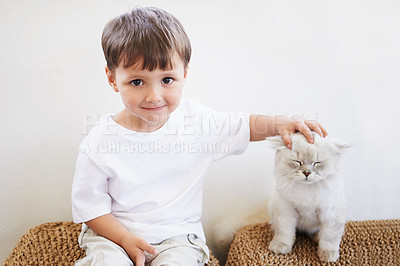 Buy stock photo Child, boy and portrait with kitten for pet, best friend and bonding with happiness in living room of home. Toddler, kid and face with animal, cat and friendship in lounge of house or apartment