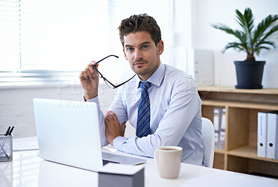 Buy stock photo Portrait, office and businessman in glasses with laptop for market research at startup with coffee. Confidence, pride and business analyst at desk with computer, opportunity and internet technology.