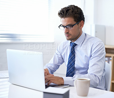 Buy stock photo Businessman, laptop and typing in office for online communication as financial consultant, email or internet. Male person, glasses and corporate company in New York for accounting, loan or investment