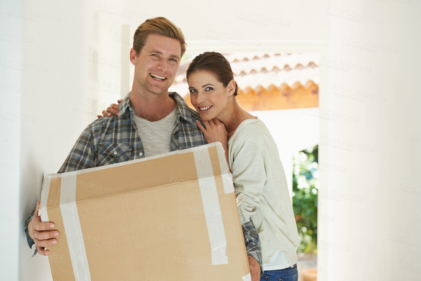 Buy stock photo New house, portrait or happy couple with box for moving or excited for investment in real estate. Man, woman and proud homeowner with package by front door and smile face in living room for mortgage
