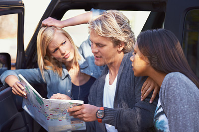 Buy stock photo Group of friends, outdoor and map for adventure, travel and lost with journey and getaway trip. Lost, man and women with paper and searching for a place with conversation and discussion with vehicle
