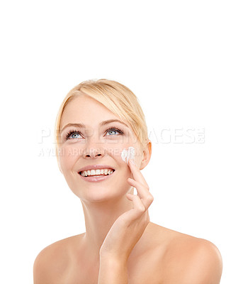 Buy stock photo Beauty, thinking and woman with face cream in studio with natural, health and skincare routine. Glow, smile and model with spf, sunscreen or lotion for dermatology treatment by white background.