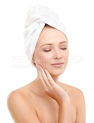 Buy stock photo Eyes closed, skincare and woman touch face in studio isolated on a white background. Spa, hand and person with towel in treatment for dermatology, wellness or glow of soft skin with makeup cosmetics