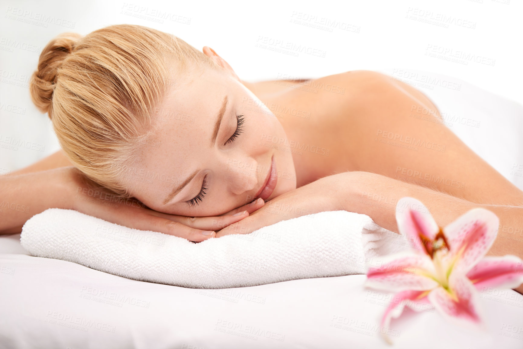 Buy stock photo Relax, sleep and woman at spa with flower for luxury holistic treatment, facial health and professional massage therapy. Self care, peace and refresh for girl on bed in natural rest for body wellness