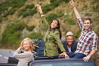 Buy stock photo Happy group, portrait and road trip on roof of car for holiday weekend, travel or outdoor vacation together. Excited friends or young people with smile in relax on convertible vehicle for adventure