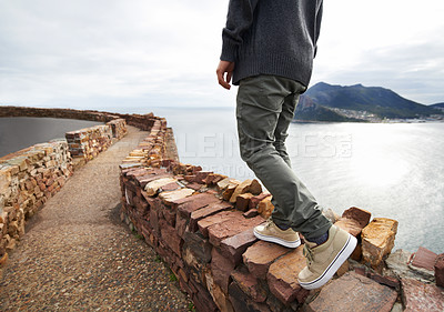 Buy stock photo Person, legs and mountain cliff at ocean for explore nature for vacation journey or adventure, walking or relax. Shoes, path and hill in South Africa for holiday for outdoor tourist,  travel or sea