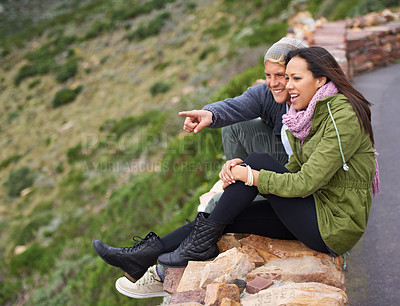 Buy stock photo Happy couple, pointing and travel for sightseeing, journey or outdoor view together in nature. Young man and woman with smile enjoying holiday, vacation or getaway in natural environment on mountain