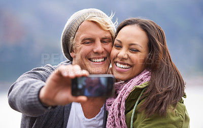 Buy stock photo Selfie, phone screen and couple hug in nature for travel, freedom or road trip adventure together. Smartphone, photography and people with love outdoor for camping, journey or social media memory