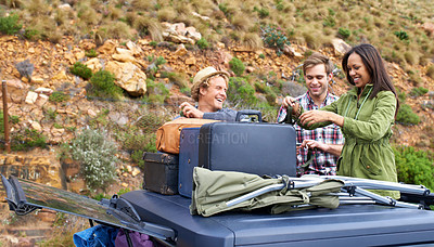 Buy stock photo Friends, group and luggage on car roof for road trip together or camping holiday as explore, mountain or vacation. Men, woman and unloading bags on vehicle in Italy or travel, journey or suitcase