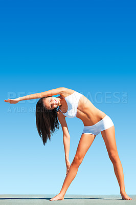 Buy stock photo Woman, yoga and stretching body for workout, exercise or fitness standing on floor against blue sky. Calm and peaceful female yogi in warm up arm stretch for healthy balance outdoors on mockup space