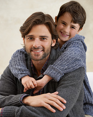 Buy stock photo Sofa, hug and portrait of father and kid for bonding, happy relationship and relax together in home. Family, parents and dad embrace young son on couch for love, childcare and smile in living room