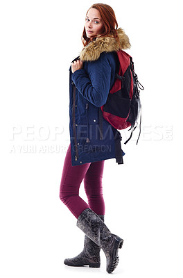 Buy stock photo Fashion, casual and portrait of a woman in a studio with a stylish, trendy and winter outfit. Style, camper and full body of a young female model with a backpack, jacket and boots by white background