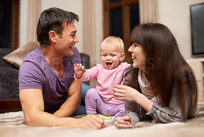Buy stock photo Love, baby and parents on a floor happy, laughing or playing while bonding in their home together, Family, support and excited kid with people in living room for child development, learning or games