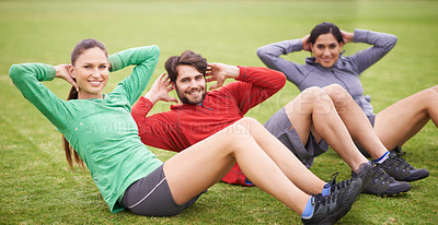 Buy stock photo Friends, sit ups and fitness on field for portrait, training or happy for abdomen exercise in summer. People, man and women with wellness with smile, core workout and group on grass lawn in Australia