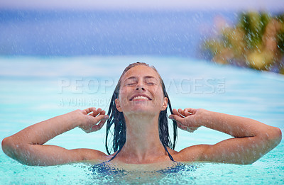 Buy stock photo Face, smile and rain with woman in swimming pool for travel, holiday or vacation as tourist. Relax, water and wellness with happy young swimmer person outdoor at tropical resort for getaway trip