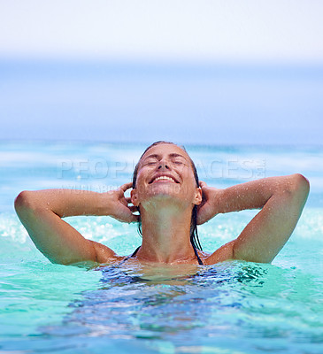 Buy stock photo Smile, swimming pool and water with woman on holiday or vacation in summer to relax for travel. Trip, wellness and tropical with happy young person on blue sky for getaway, joy or fun outdoor