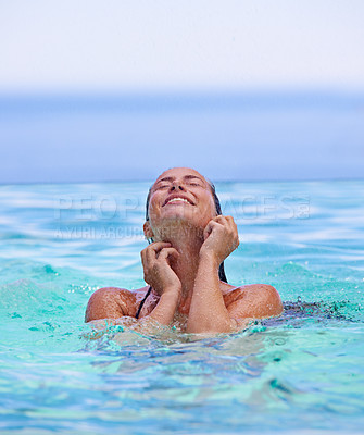 Buy stock photo Face, smile and summer with woman in swimming pool for travel, holiday or vacation on blue sky. Tropical, wellness and wet with happy young swimmer person in water to relax at resort for getaway