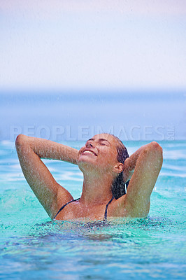 Buy stock photo Face, smile and raining with woman in swimming pool for travel, holiday or vacation as tourist. Relax, water and wet with happy young swimmer person outdoor at tropical resort for hospitality