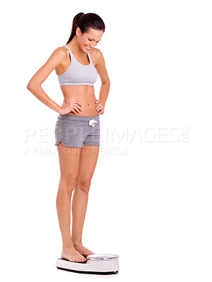 Buy stock photo Scale, happy and woman in studio for weight loss, health and wellness diet victory or success. Smile, fitness and person measuring body for exercise, workout or training by white background.