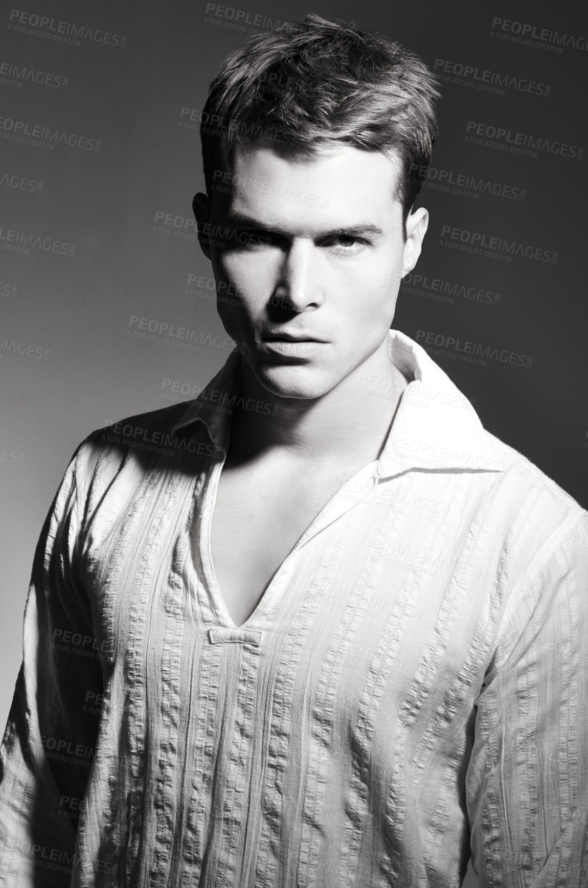 Buy stock photo Fashion, serious and portrait of man in studio with casual, trendy and stylish outfit. Confidence, monochrome and face of handsome young male model with cool style isolated by black background.