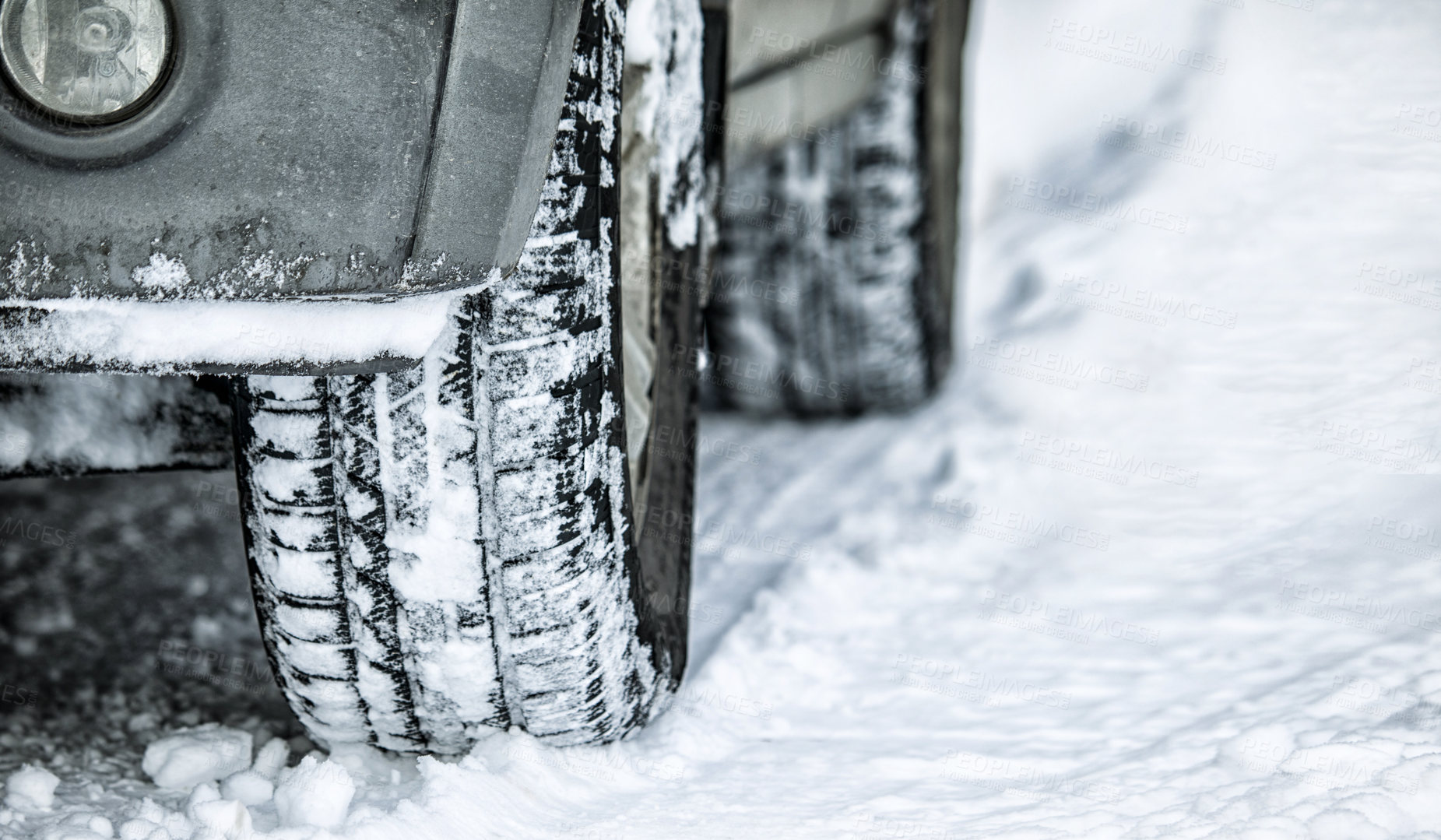 Buy stock photo Tire, winter and car in danger on snow or ice for a road trip, travel and outdoor journey using transport in cold weather. Closeup of ice, transportation and vehicle driving on a track in nature