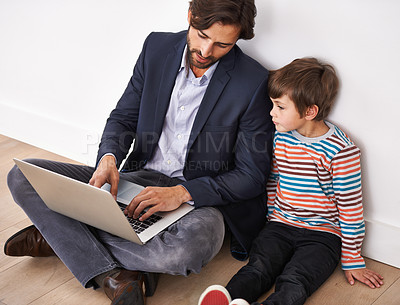 Buy stock photo Father, son and bonding on floor with laptop for remote work with video streaming, online games and movies in home. Family, parent and child with technology on ground for relax, communication and fun