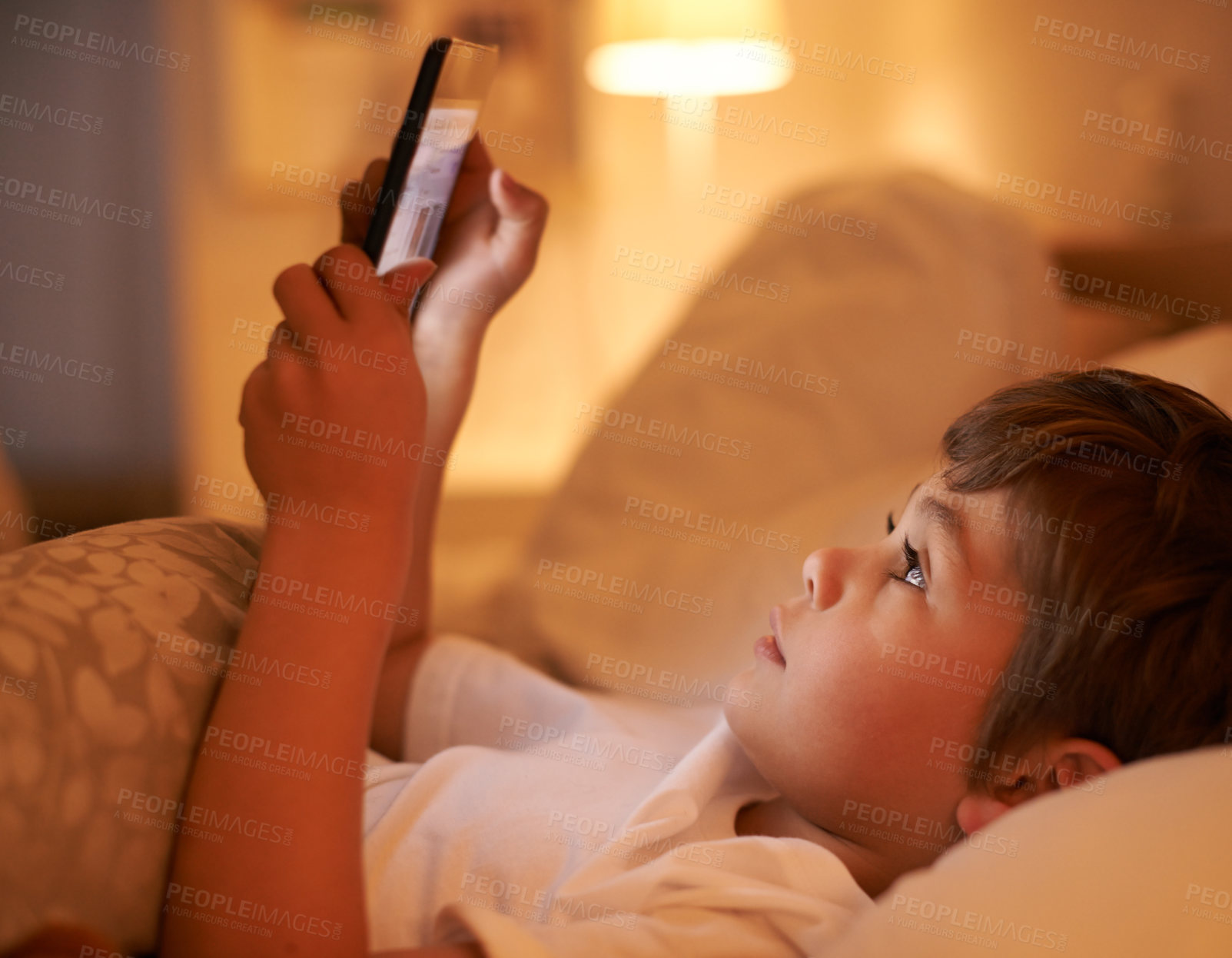 Buy stock photo Boy, kid and tablet in bedroom at night for typing, reading or online game with app in family home. Child, bed and digital touchscreen for movie, cartoon and streaming subscription to relax in house