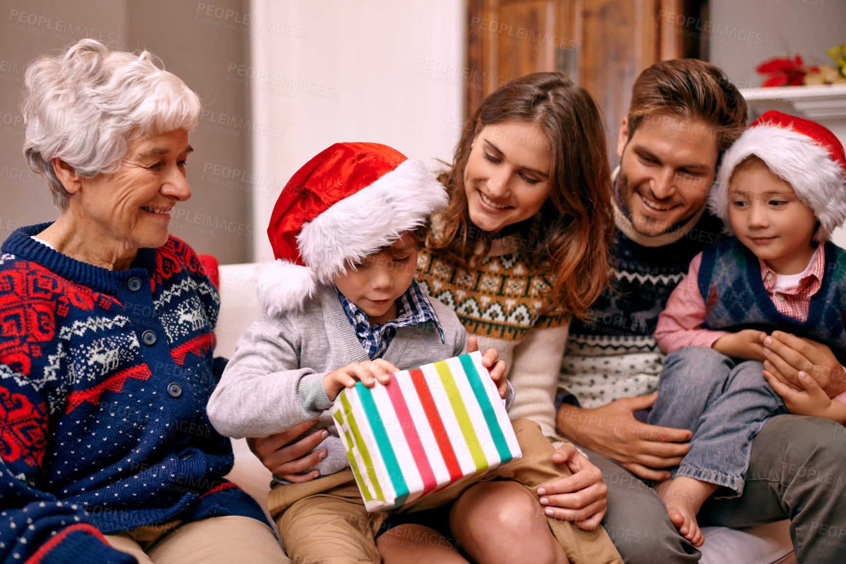 Buy stock photo Shot of a family enjoying themselves at Christmas