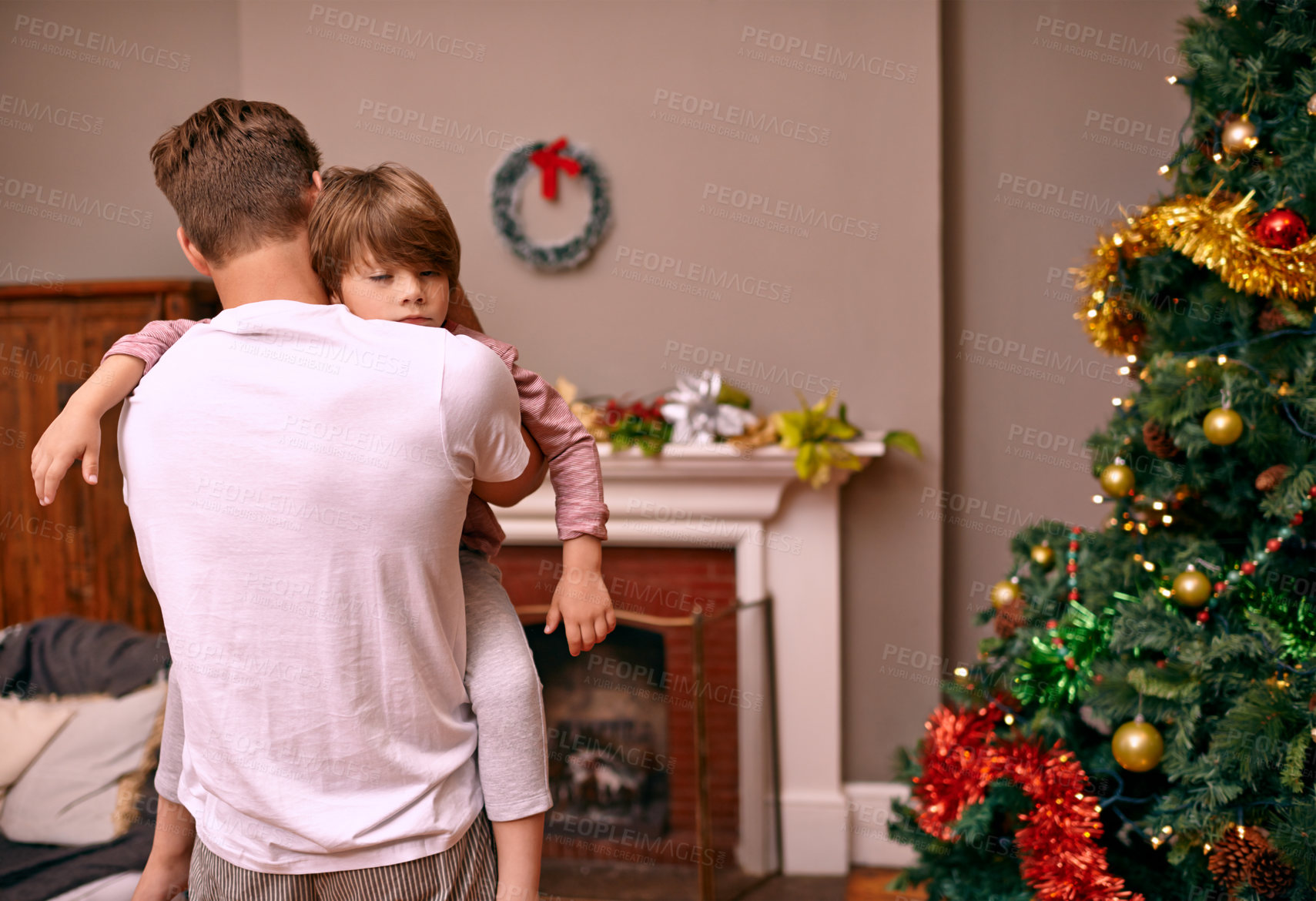 Buy stock photo Father, son and embrace with comfort on christmas for celebration, sleeping and love in the morning. Family, man and child with hug, relax and enjoying holiday season in living room or lounge of home