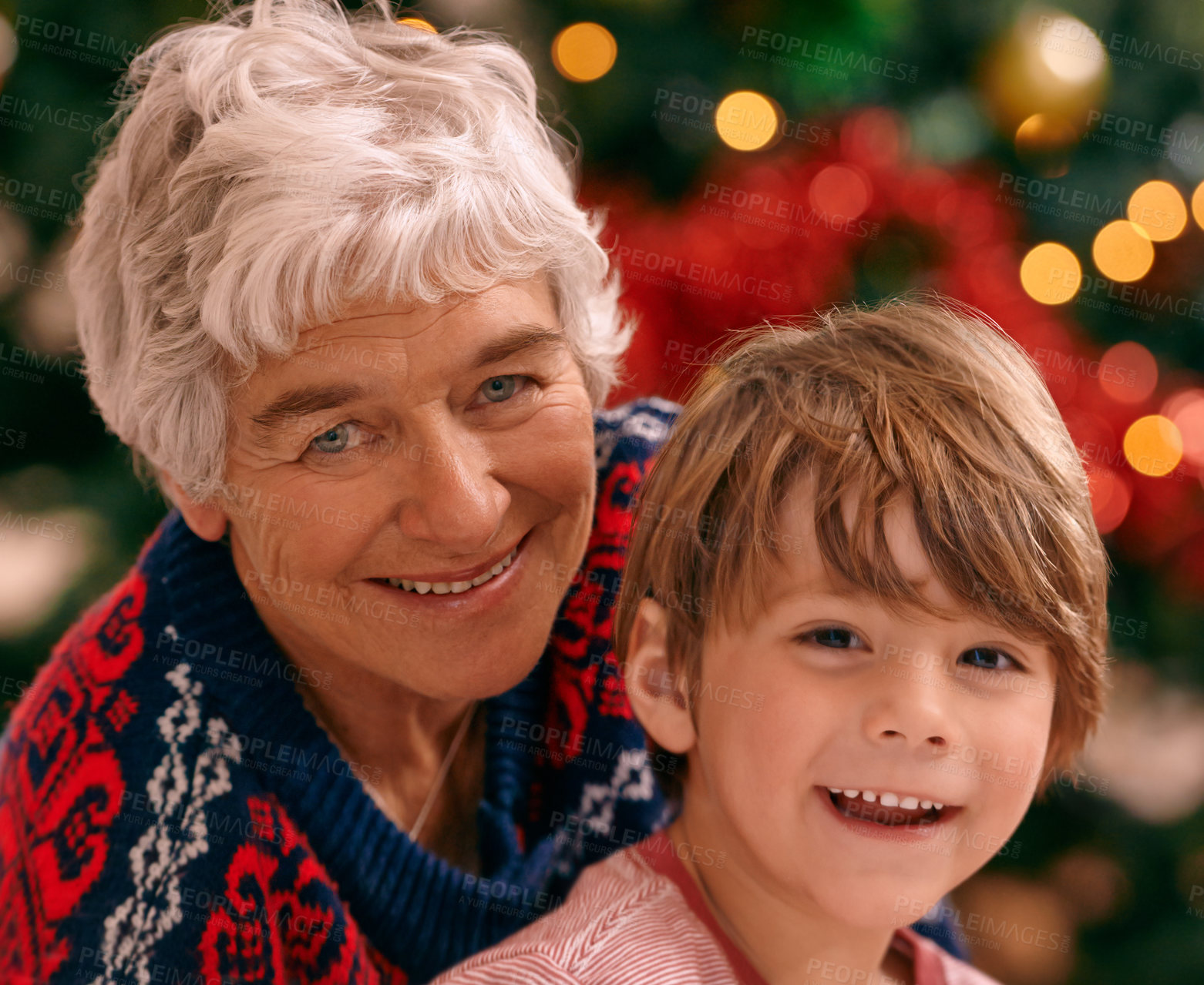 Buy stock photo Christmas, portrait and celebration in living room, grandma and grandchild smile with happiness. House, elderly woman and kid together for holiday as family in lounge, tree and love   in home