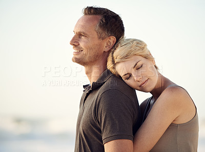 Buy stock photo Couple, beach and holiday hug for outdoor bonding in California or travel commitment, love or together. Man, woman and embrace for sea vacation or relax in nature for relationship, sunset or summer