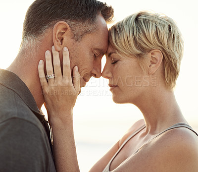 Buy stock photo Closeup of a woman holding her husband while they stand outside