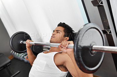 Buy stock photo Bench, press and man at gym for workout, exercise and body building in Mexico. Healthy, person and weightlifting challenge for strong muscle, fitness or progress in training arms with barbell at club