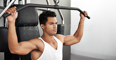 Buy stock photo A young ethnic man exercising in the gym