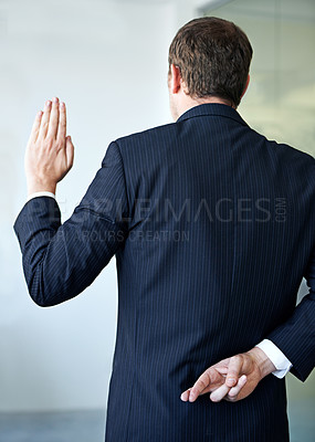 Buy stock photo Businessman, back and fingers crossed with luck of liar for hope, confidential or secret at office. Rear view of man or business employee hiding hand in conspiracy, lie or swear for truth or honesty