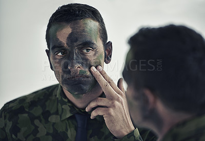 Buy stock photo Soldier, man and face in mirror with camouflage paint with thinking, decision or brave to fight war. Person, agent or officer in military with reflection for choice, uniform and ready for conflict