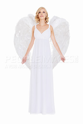 Buy stock photo Studio shot of a young woman in angel wings isolated on white