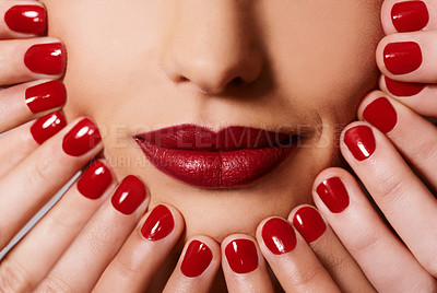 Buy stock photo Beauty, cosmetics and woman with manicure, red lipstick and creative aesthetic for glamour. Luxury makeup, face and hands with nail polish for self care, shine and happy mouth of model with product