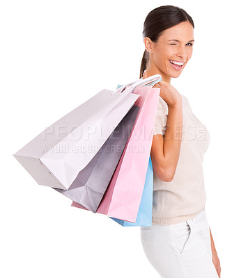 Buy stock photo Wink, shopping and portrait of woman on a white background with bag for sale, discount and deal. Excited, happy customer and isolated person for retail, consumerism and fashion purchase in studio