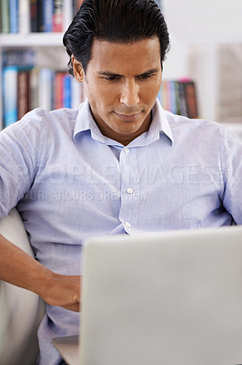 Buy stock photo Businessman, laptop and reading on sofa in home for remote work, research and online planning in living room. Entrepreneur, person and technology with corporate project, communication and web surfing